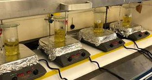 Photograph of titanium feedstock dissolution during the synthesis of isotopically-barcoded Ti taggants.
