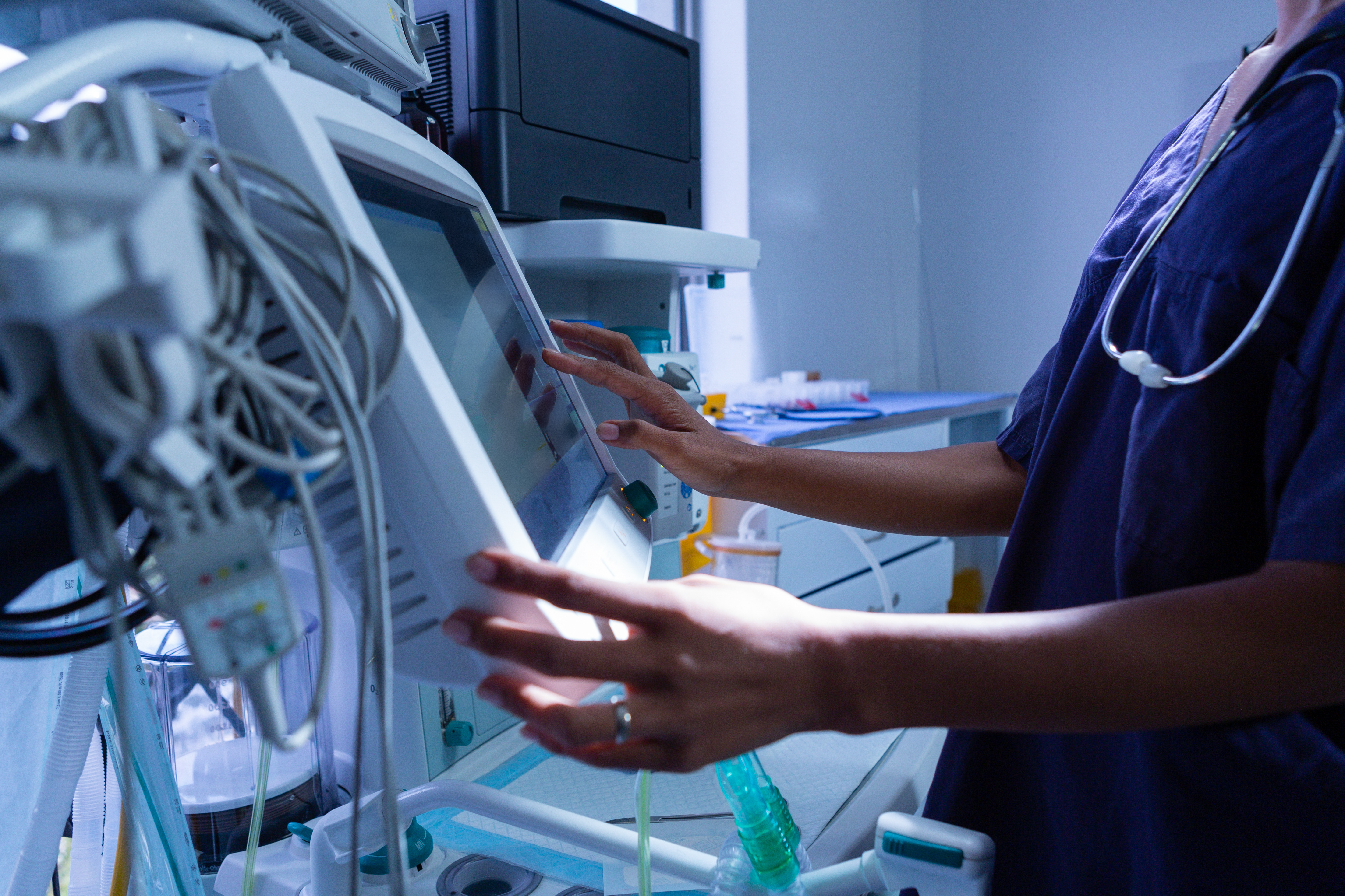 Female nurse doing sterilization of dental medical instruments in autoclave. Sterilization department at dental clinic.