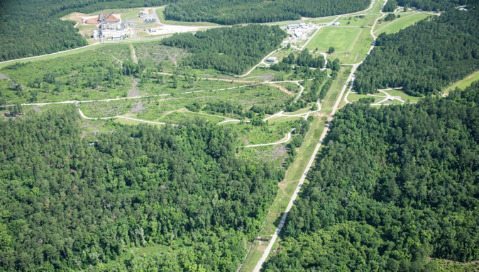 aerial view of forest and wetlands with roads