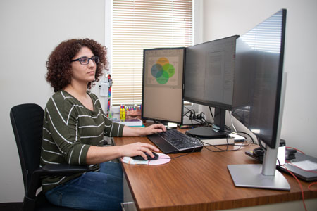woman typing on computer